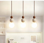 Wabi Sabi Stone Pendant Lamp With Smooth Wood Spheres And Textured Stone
